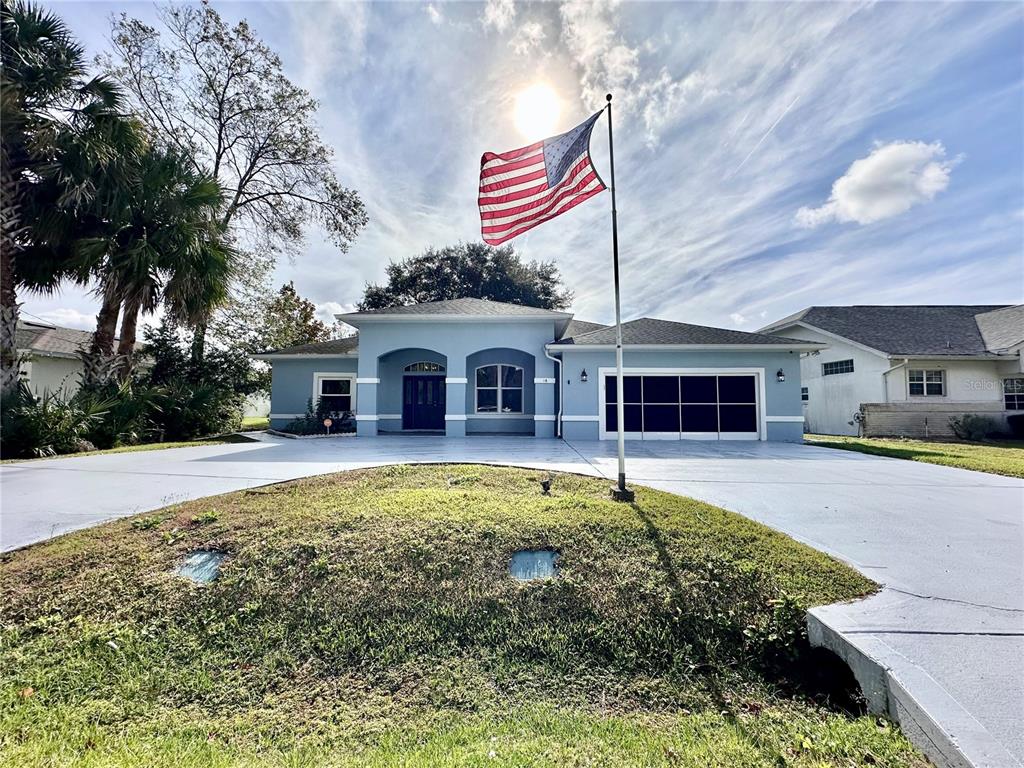 16 Westbrook Lane Palm Coast, FL 32164 - Photo 42 of 42 a house with swimming pool in front of it