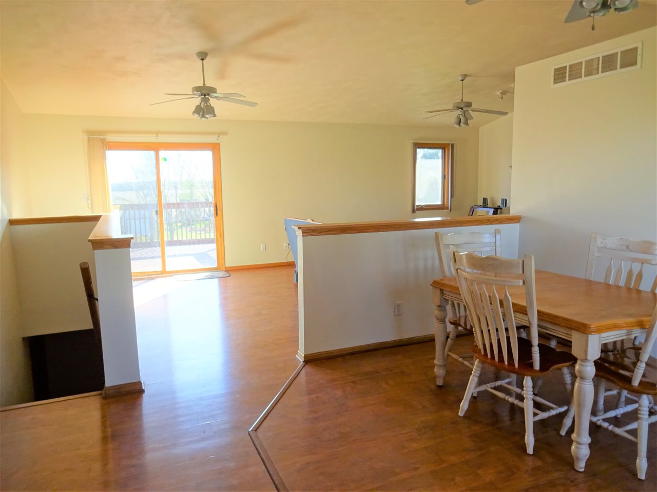 1999 East Water Road Byron, IL 61010 - Photo 3 of 15 a view of a room with furniture and wooden floor