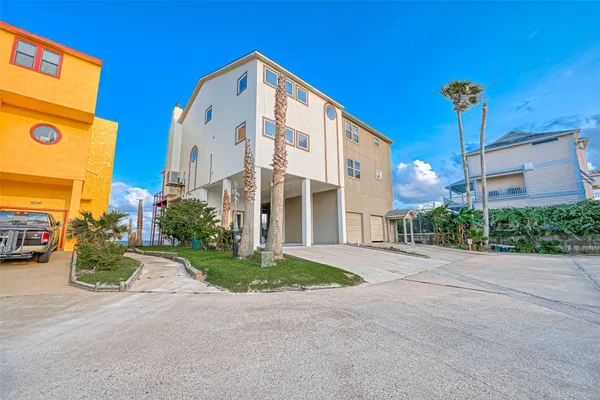 a front view of a building with garden