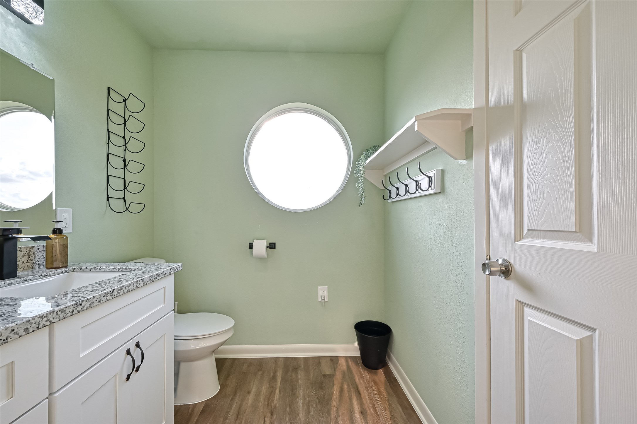 2102 Todville Road, Unit 9 Seabrook, TX 77586 - Photo 23 of 34 a bathroom with a granite countertop toilet sink and mirror