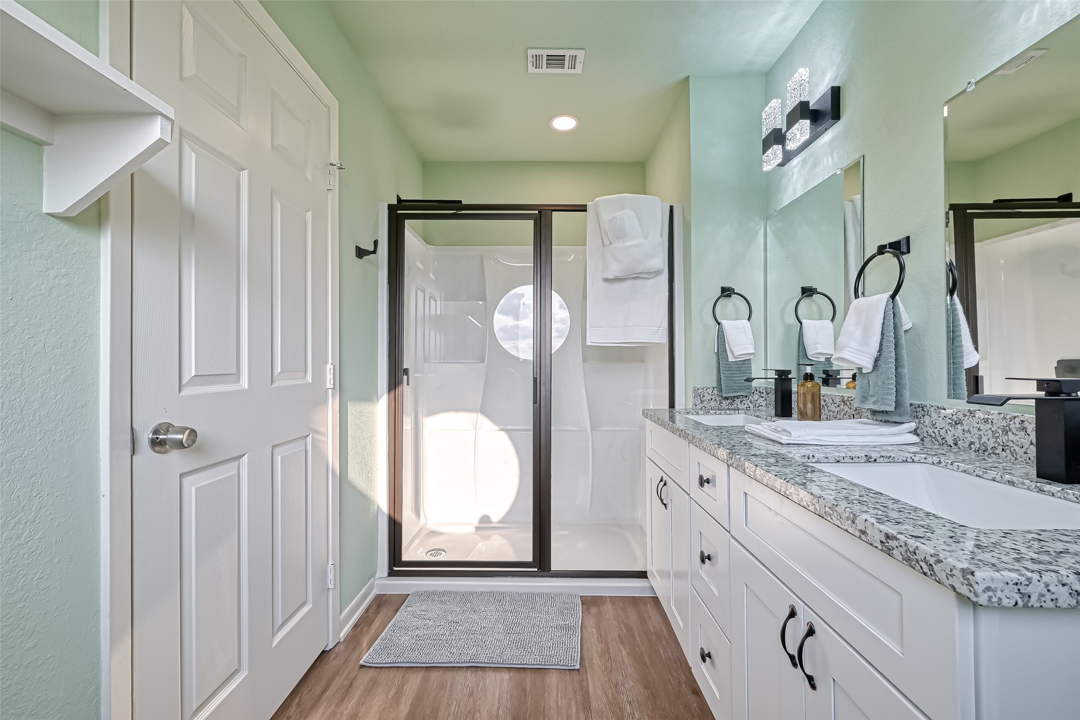 2102 Todville Road, Unit 9 Seabrook, TX 77586 - Photo 24 of 34 a spacious bathroom with a granite countertop sink mirror and double vanity