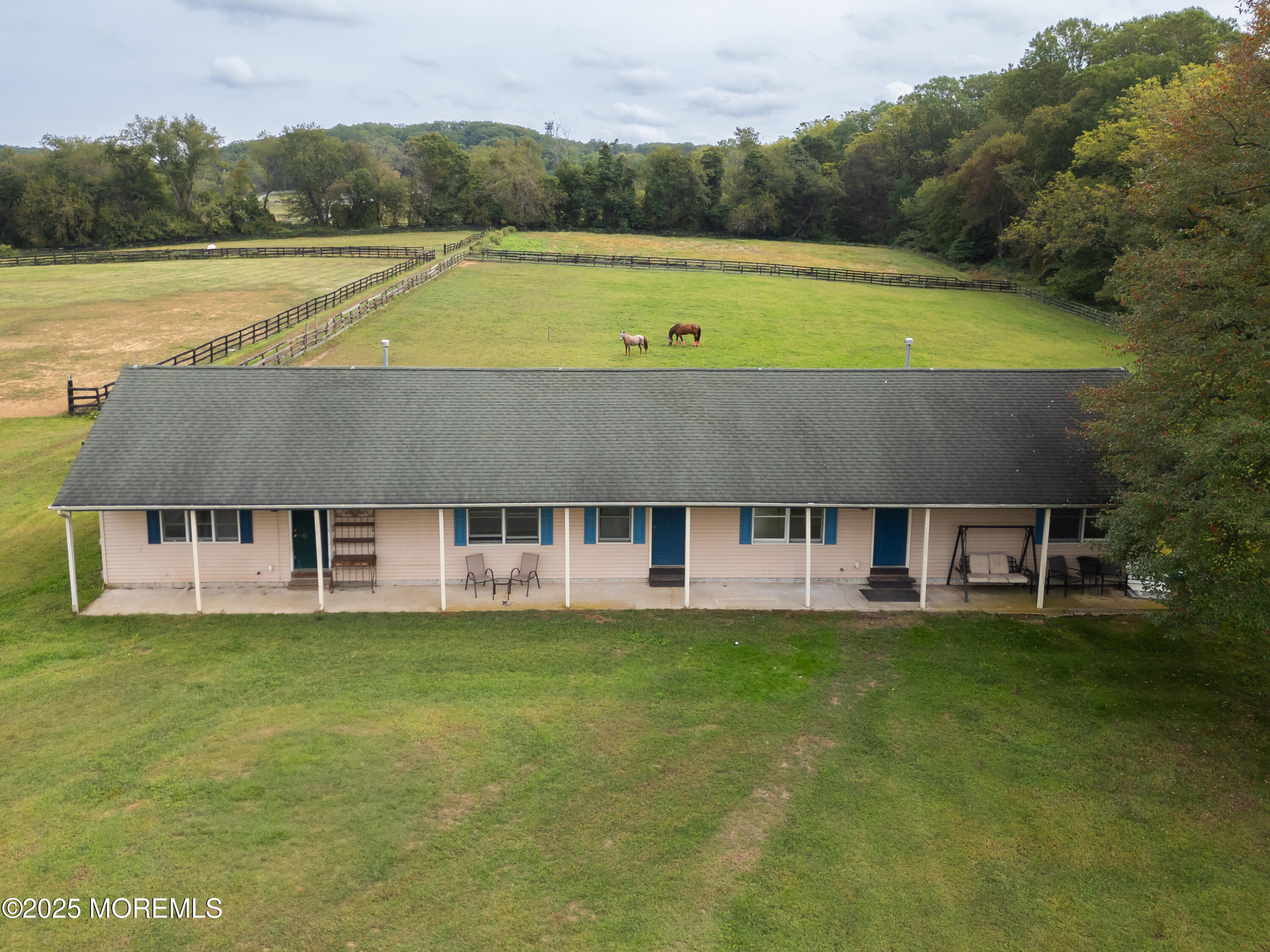 a aerial view of a house with a big yard