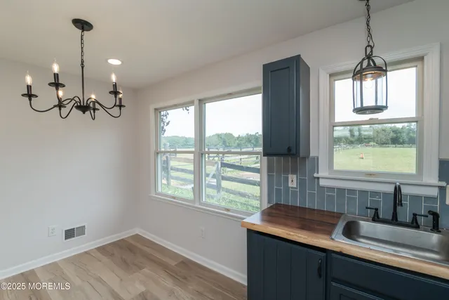 a view of a livingroom with a ceiling fan and window