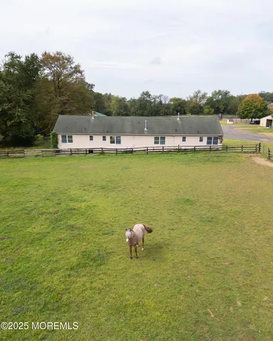 a view of a lake with houses in the back