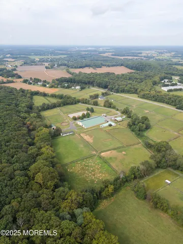 a view of a swimming pool with a yard