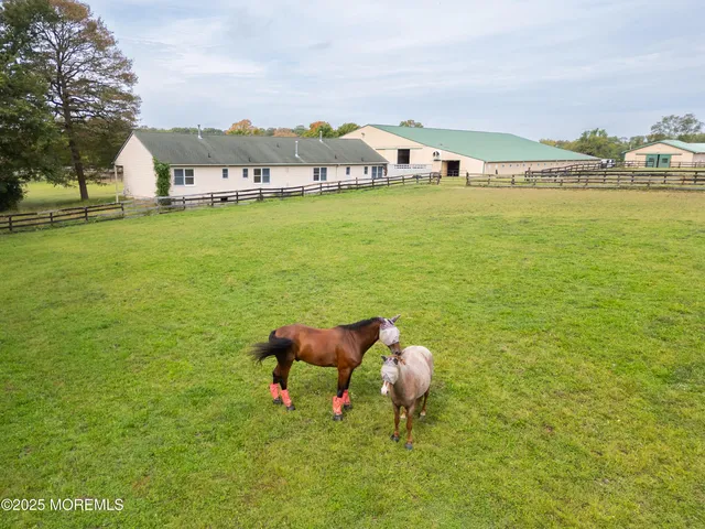 a house view with a sitting space garden view with a garden