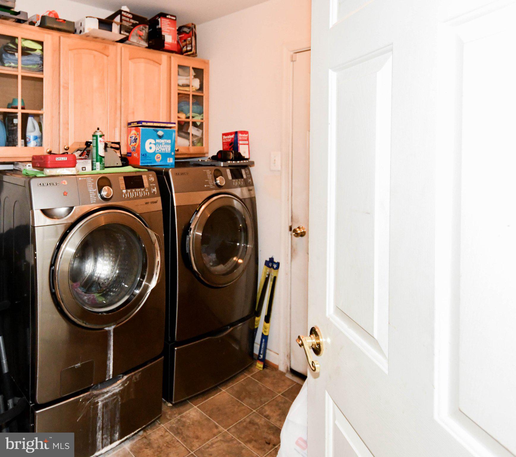 3208 Clavier Place Clinton, MD 20735 - Photo 14 of 55 Modern laundry space with ample storage.