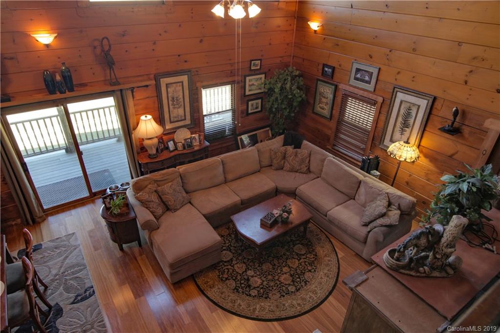 75 Stanley Dr Mill Spring Mill Spring, NC 28756 - Photo 22 of 48 a living room with furniture and a fireplace