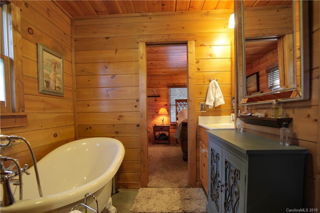 75 Stanley Dr Mill Spring Mill Spring, NC 28756 - Photo 29 of 48 a bathroom with a sink and a bathtub