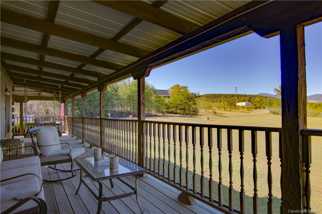 75 Stanley Dr Mill Spring Mill Spring, NC 28756 - Photo 33 of 48 a view of a balcony with chairs