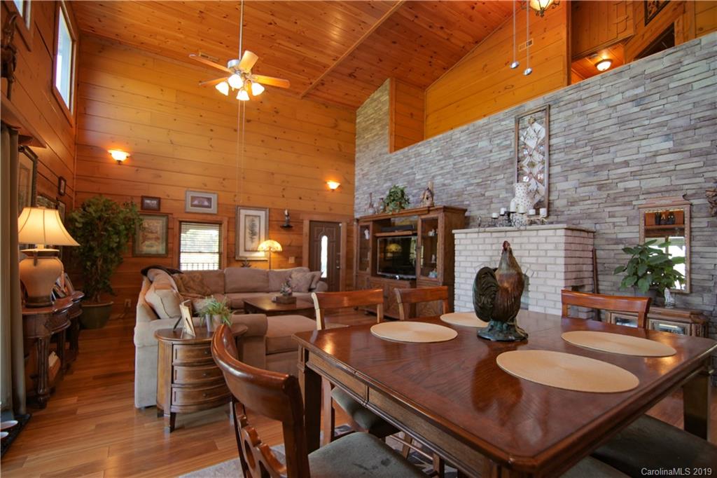 75 Stanley Dr Mill Spring Mill Spring, NC 28756 - Photo 8 of 48 a view of a dining room with furniture and wooden floor