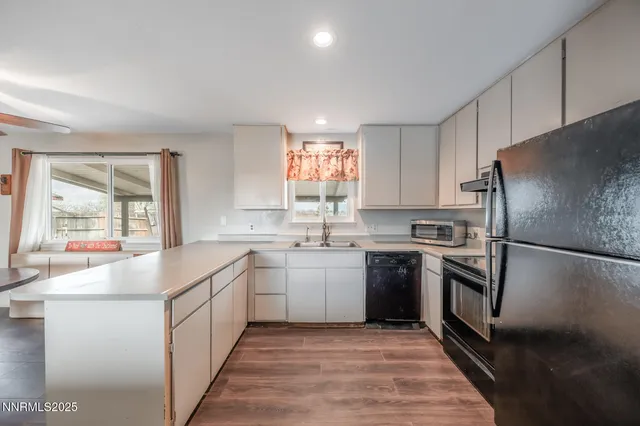 a room with couch and wooden floor