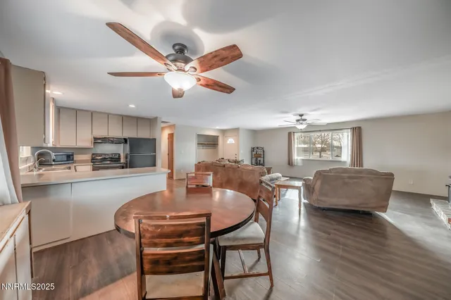 a view of a dining room with furniture window and wooden floor
