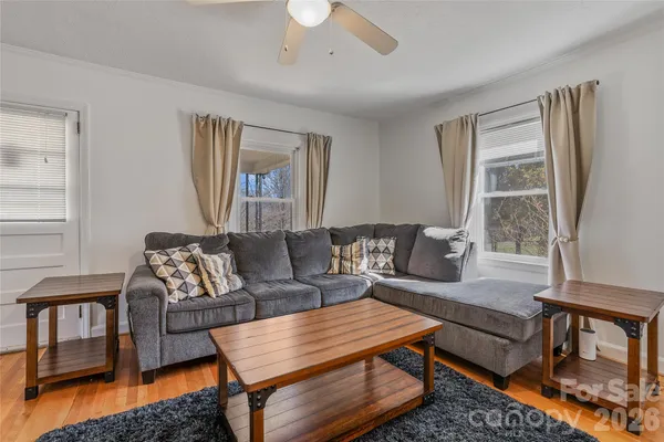a living room with furniture and a window