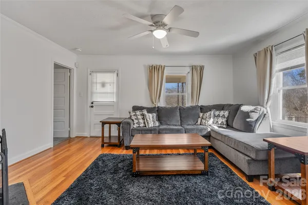 a living room with furniture and a table