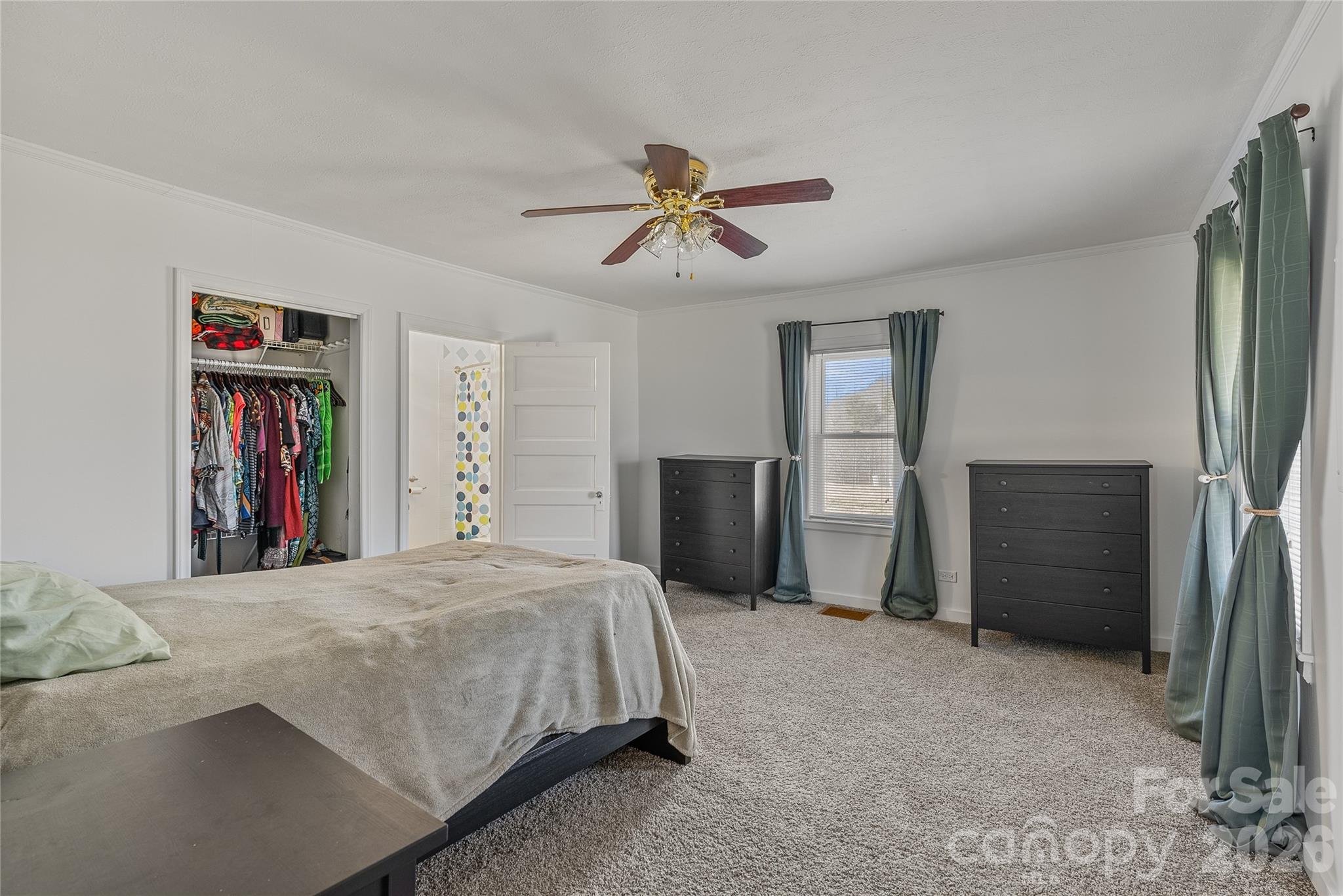 21 Ben Owenby Road Fairview, NC 28730 - Photo 17 of 38 a bed room with a bed and a book shelf