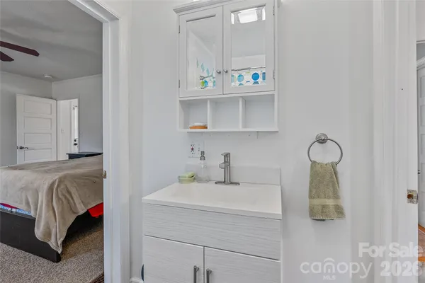 a bathroom with a sink and vanity