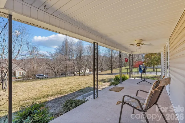 a view of yard with patio