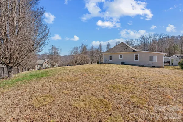 a view of road with snow on the roadside