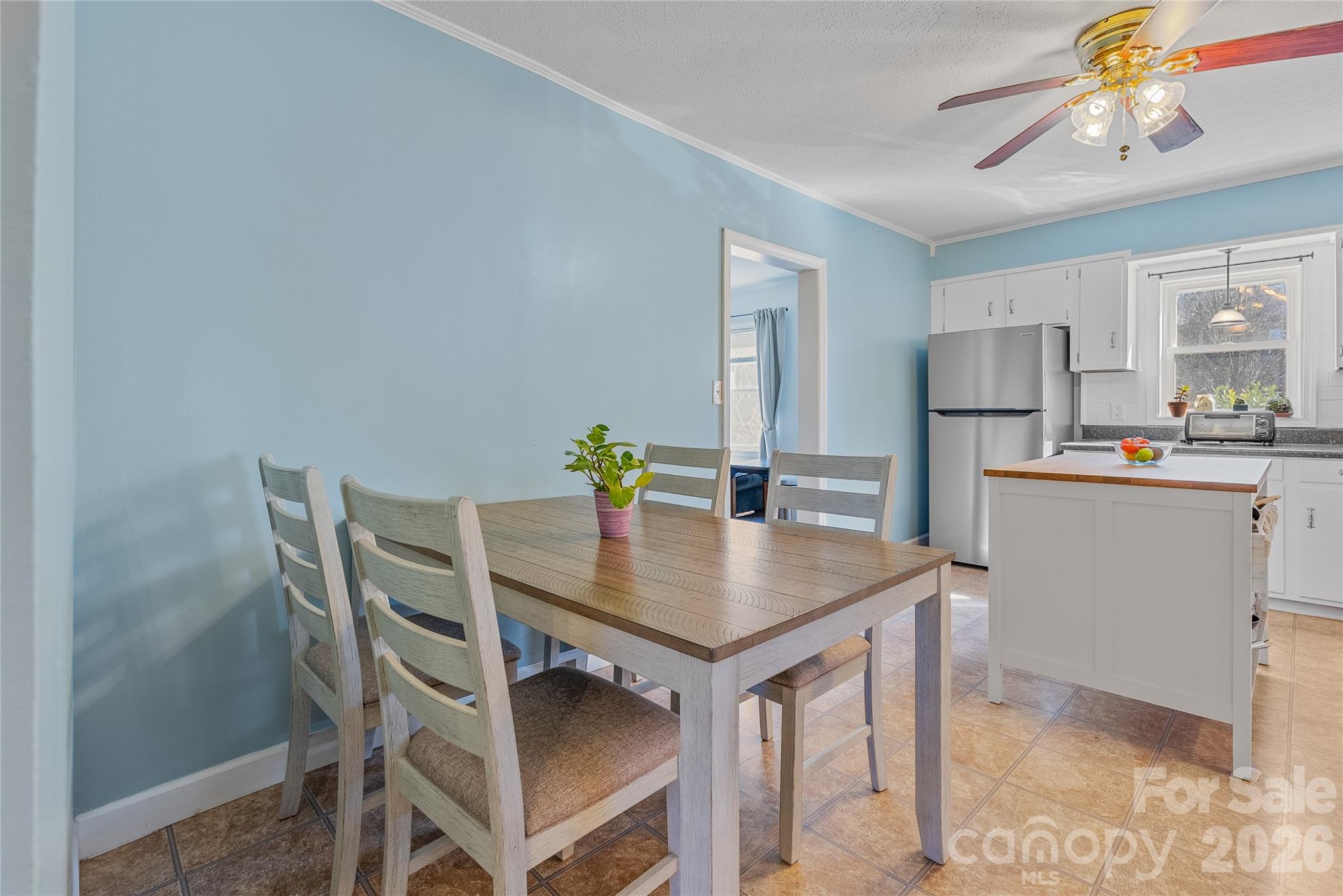 21 Ben Owenby Road Fairview, NC 28730 - Photo 7 of 38 a view of a dining room that has a table and chairs in it