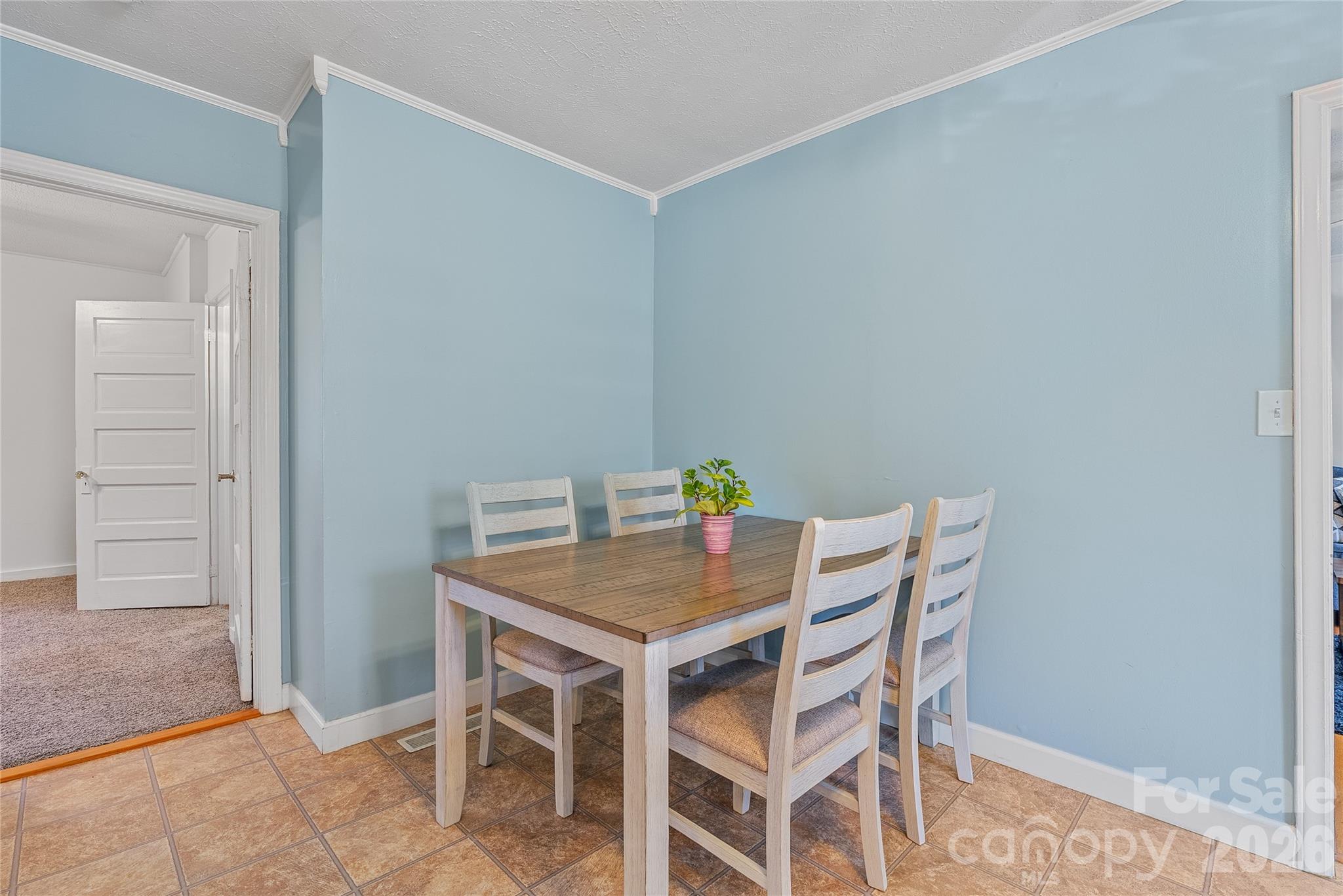21 Ben Owenby Road Fairview, NC 28730 - Photo 8 of 38 a view of a dining room that has a table and chairs in it