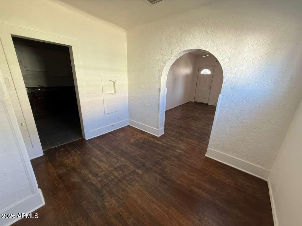 1315 C Avenue Douglas, AZ 85607 - Photo 4 of 10 an empty room with wooden floor and closet