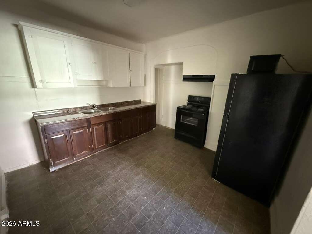 1315 C Avenue Douglas, AZ 85607 - Photo 5 of 10 a kitchen with stainless steel appliances granite countertop a refrigerator a stove a sink and dishwasher