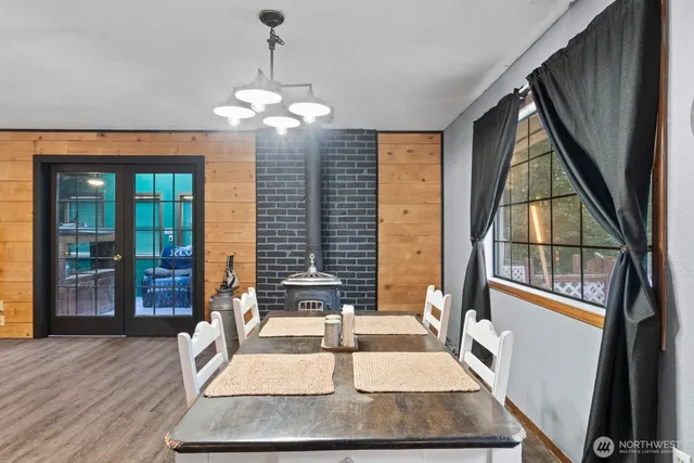a view of a livingroom with furniture window and wooden floor