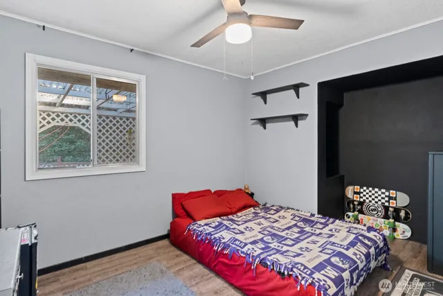 a bedroom with a bed and a window