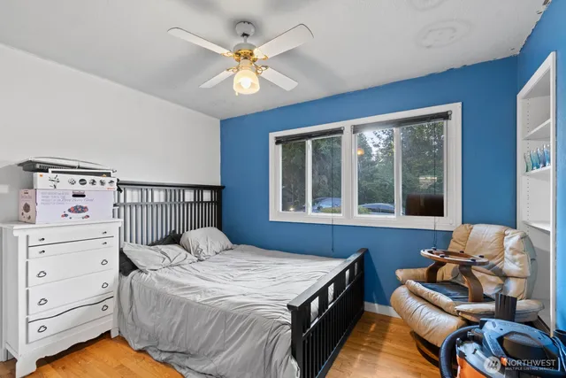 a bedroom with a bed and window