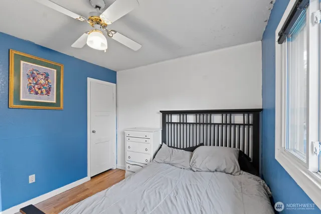 a bedroom with a bed and window