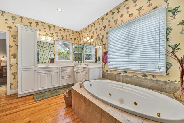 a bathroom with a bathtub and a sink