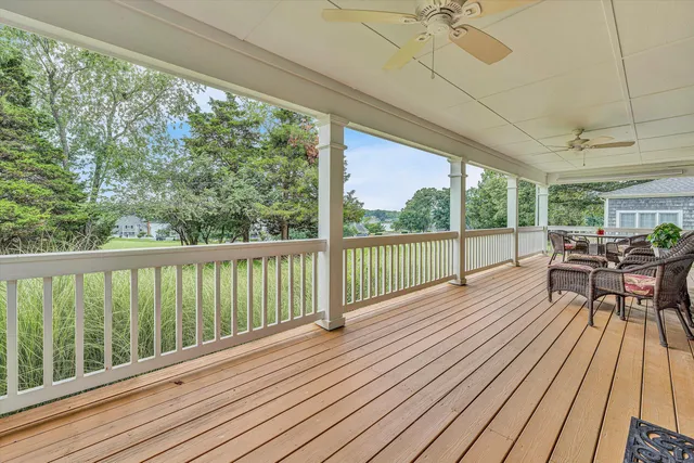 a view of balcony with furniture and wooden deck