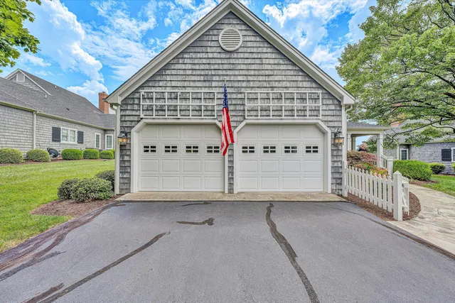 an aerial view of a house with a garden and entryway