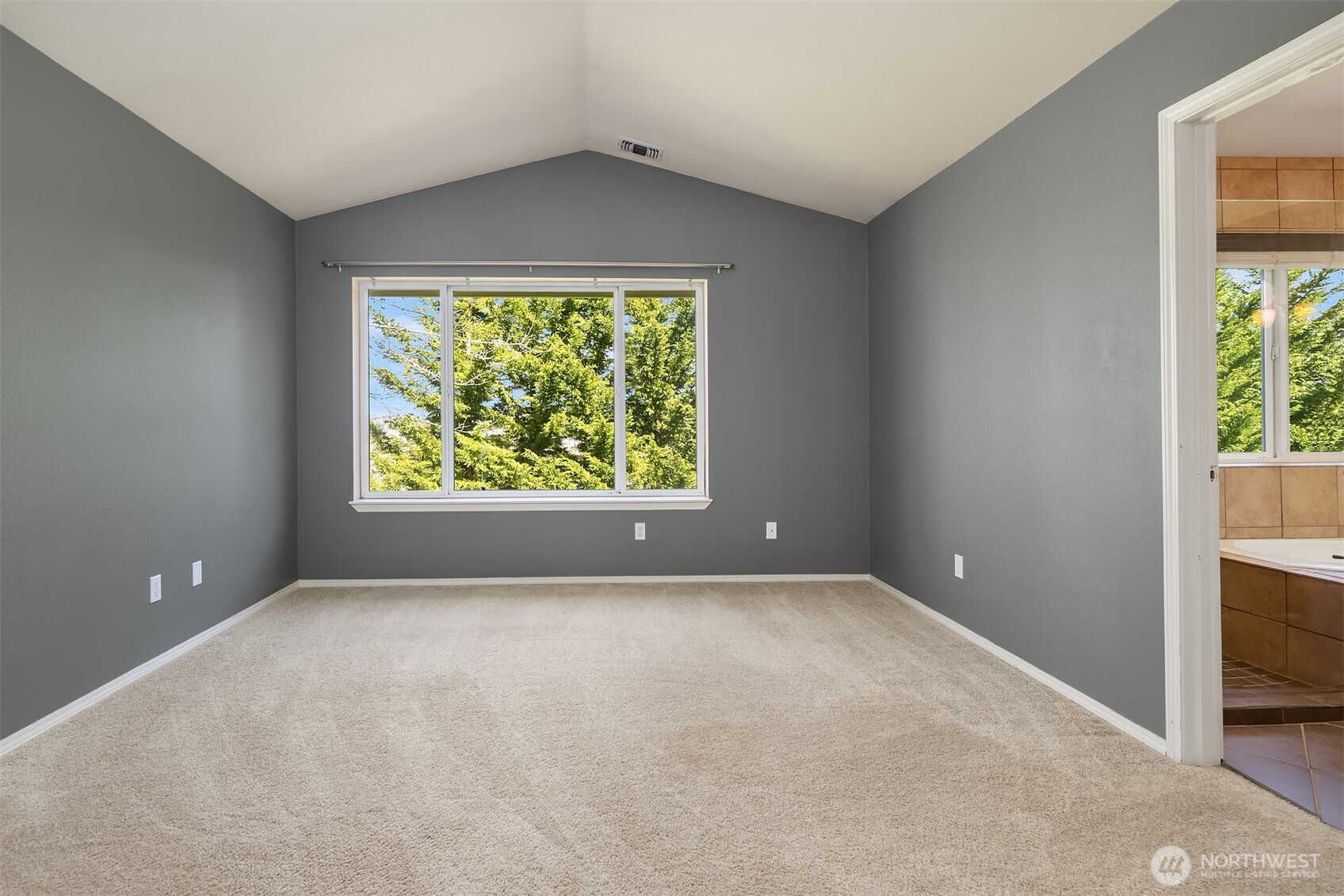 12113 Northeast 172nd Place, Unit J202 Bothell, WA 98011 - Photo 15 of 29 an empty room with a window