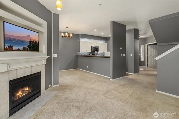 a view of a kitchen with a sink and a window
