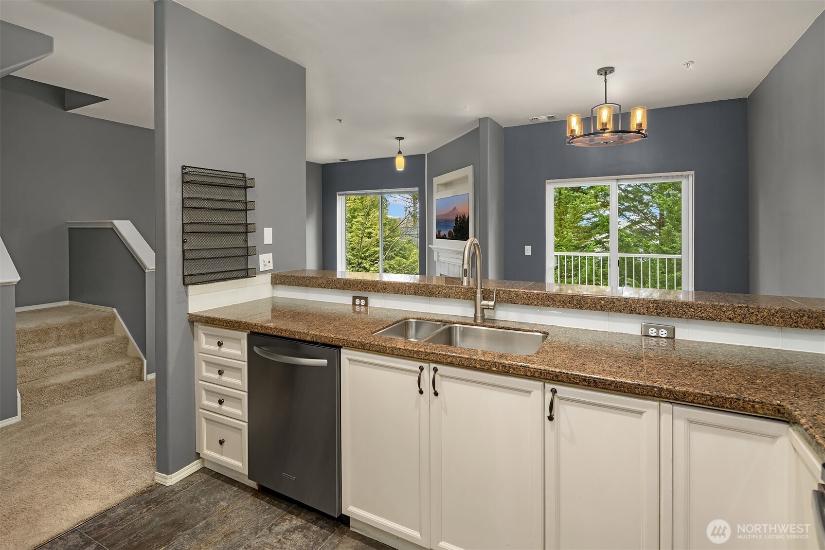 12113 Northeast 172nd Place, Unit J202 Bothell, WA 98011 - Photo 10 of 29 a kitchen with a sink stove and window