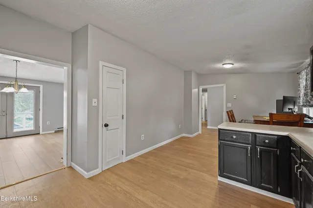 a view of a kitchen with electric appliances