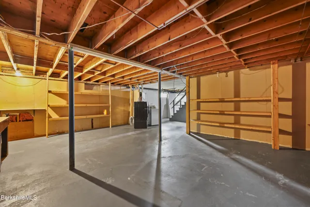 a view of backyard with small cabin