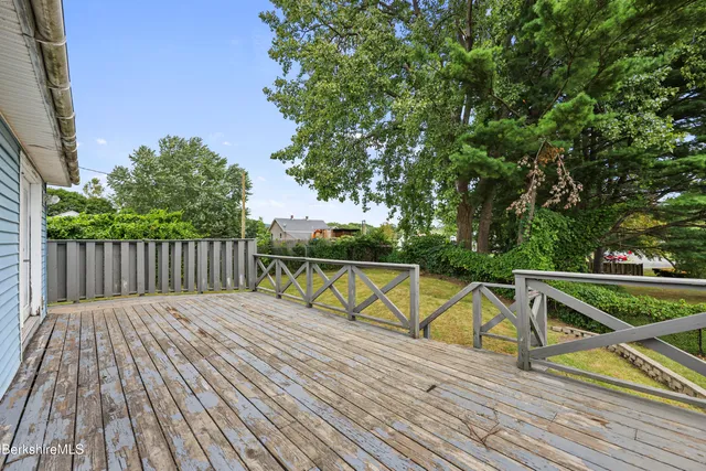 a view of balcony with deck and wooden floor
