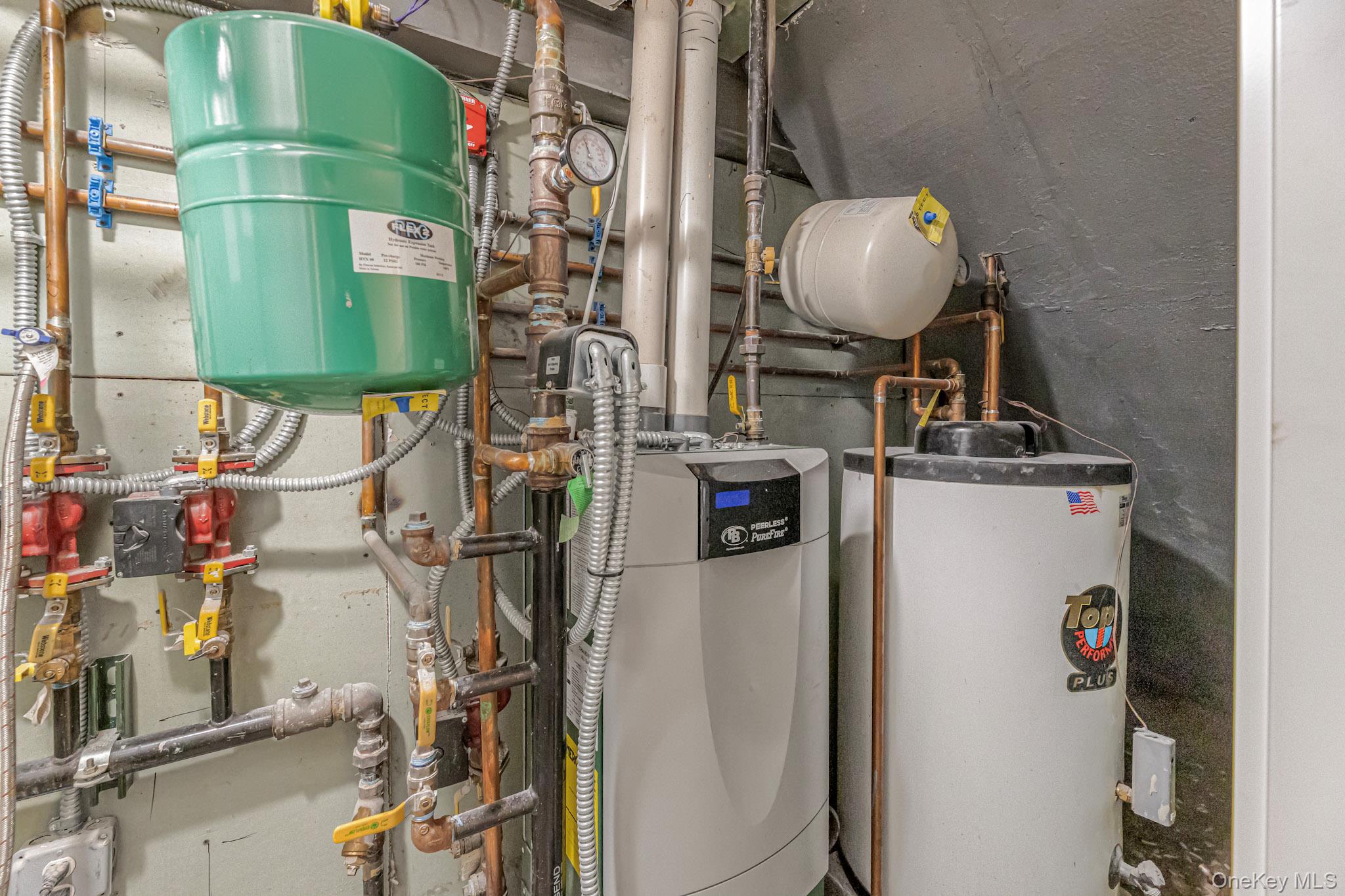 9 Lyons Place New Rochelle, NY 10801 - Photo 12 of 20 Utility room featuring water heater