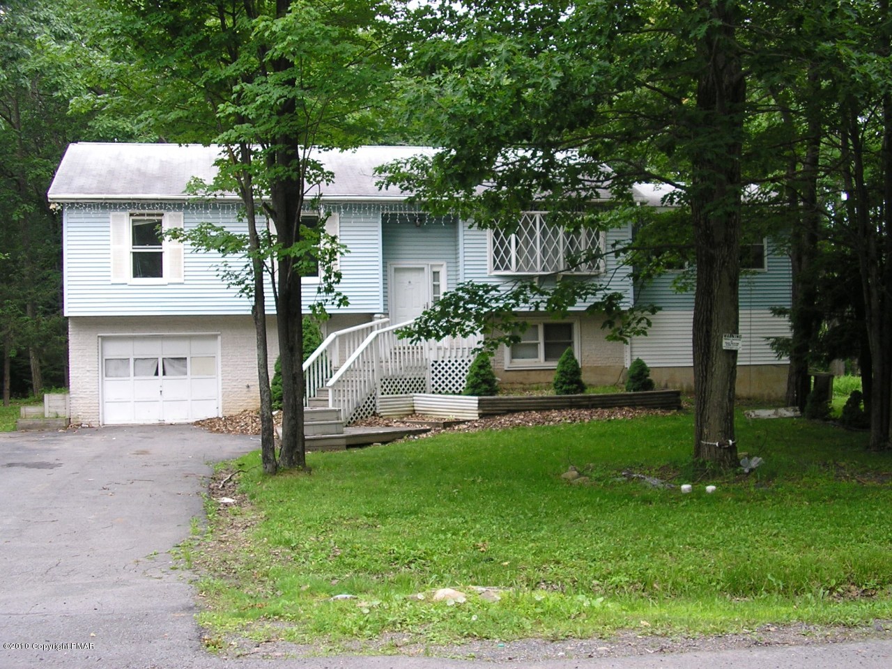 19 Edgewood Road Mount Pocono, PA 18344 - Photo 1 of 8 a front view of a house with garden