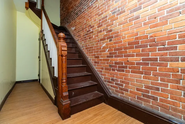 a view of entryway with wooden floor