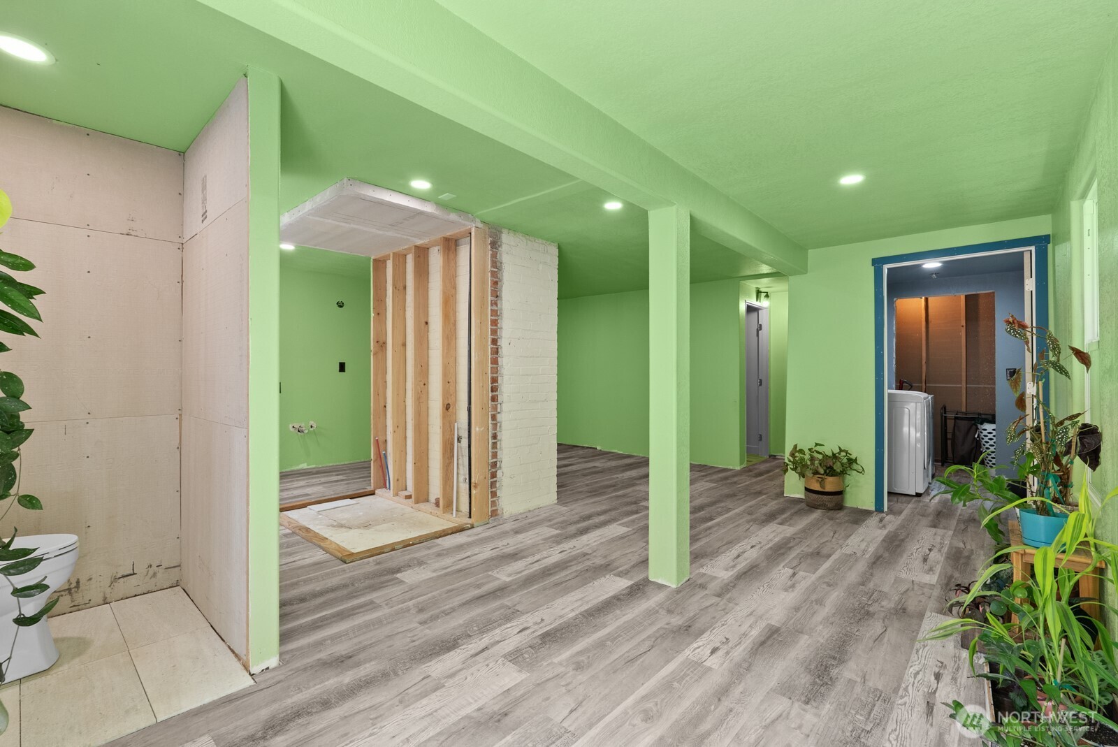 307 4th Street Steilacoom, WA 98388 - Photo 25 of 39 a view of a hallway with wooden floor and plants