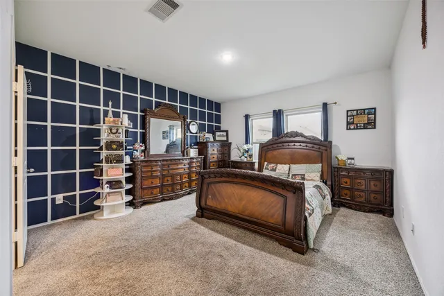 a bedroom with furniture and walk in closet