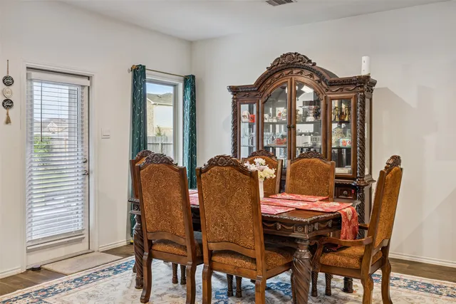 a view of a dining room with furniture and window