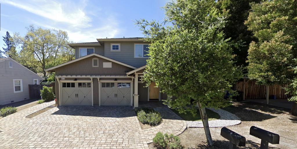a view of a house with a yard