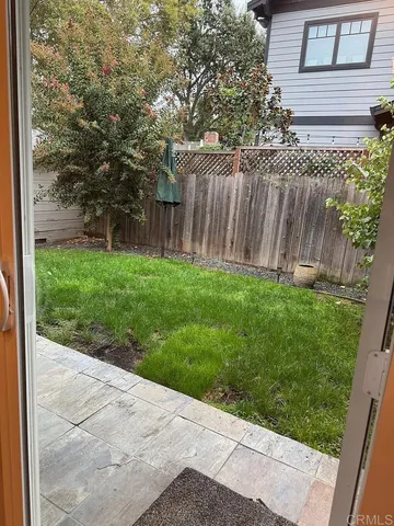 a backyard of a house with lots of green space