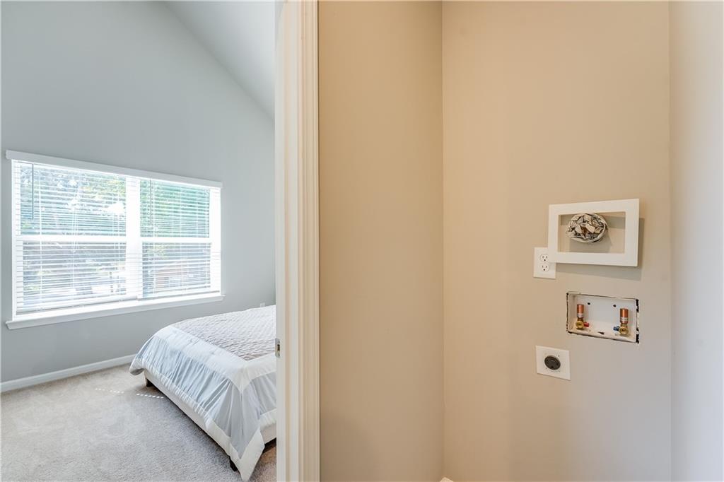 958 Lawton Street Southwest Atlanta, GA 30310 - Photo 8 of 16 a bedroom with a bed and a window