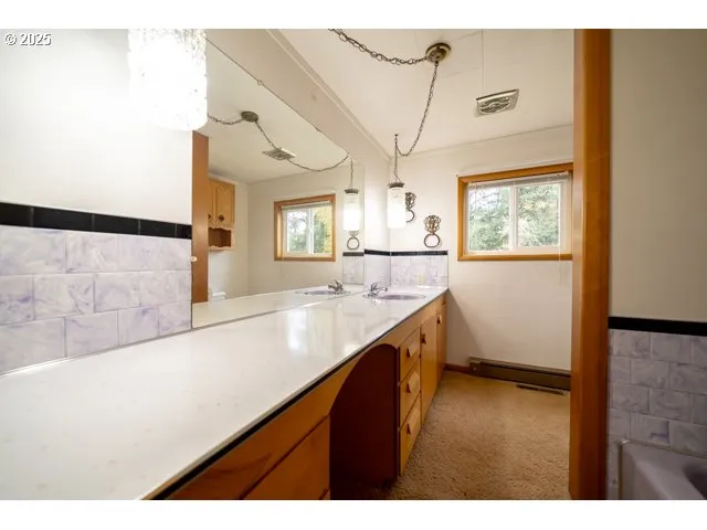 a bathroom with a bathtub and shower